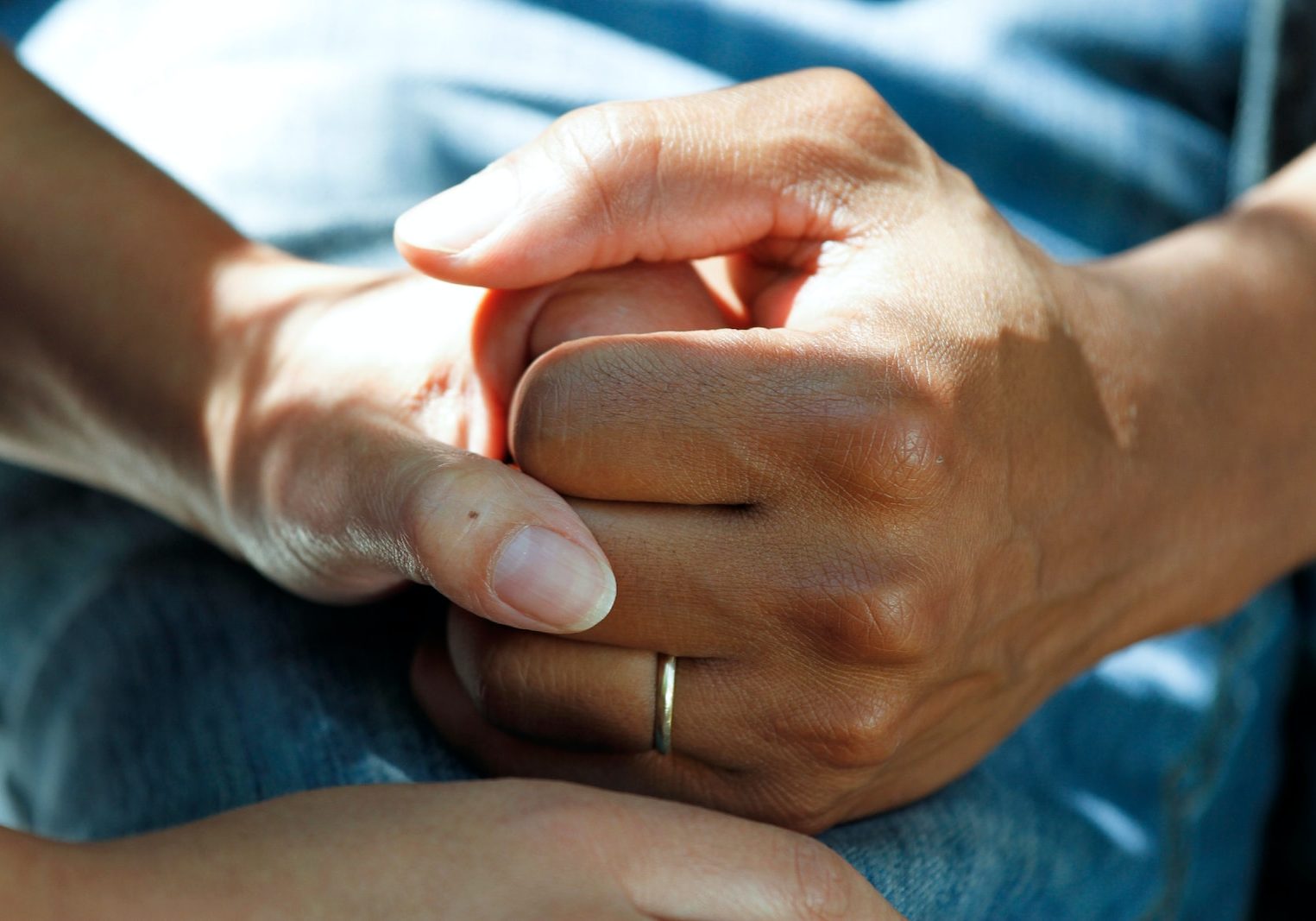 person wearing gold wedding band